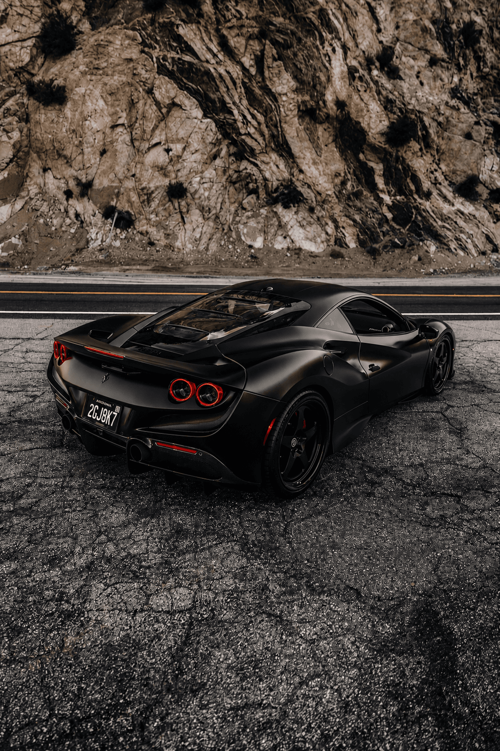 Blackout Plate mounted on a matte black Ferrari