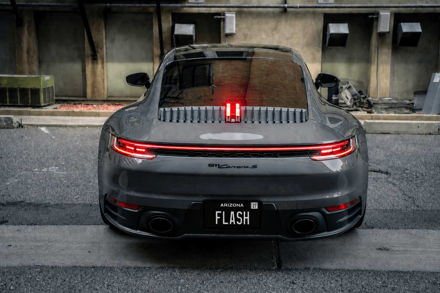 Blackout Plate mounted on a gray Porsche 911