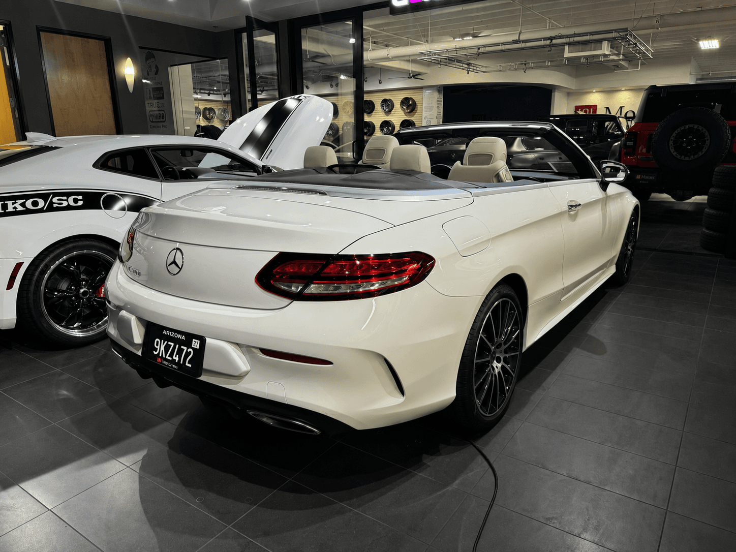 Blackout Plate mounted on a white Mercedes convertible